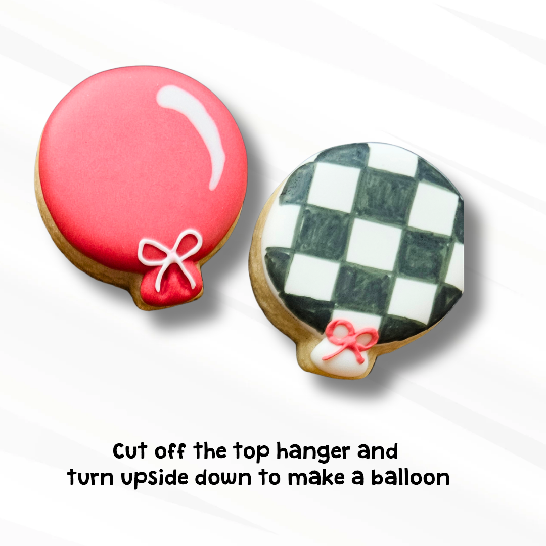 To decorated sugar cookies shaped like balloons on a white background.