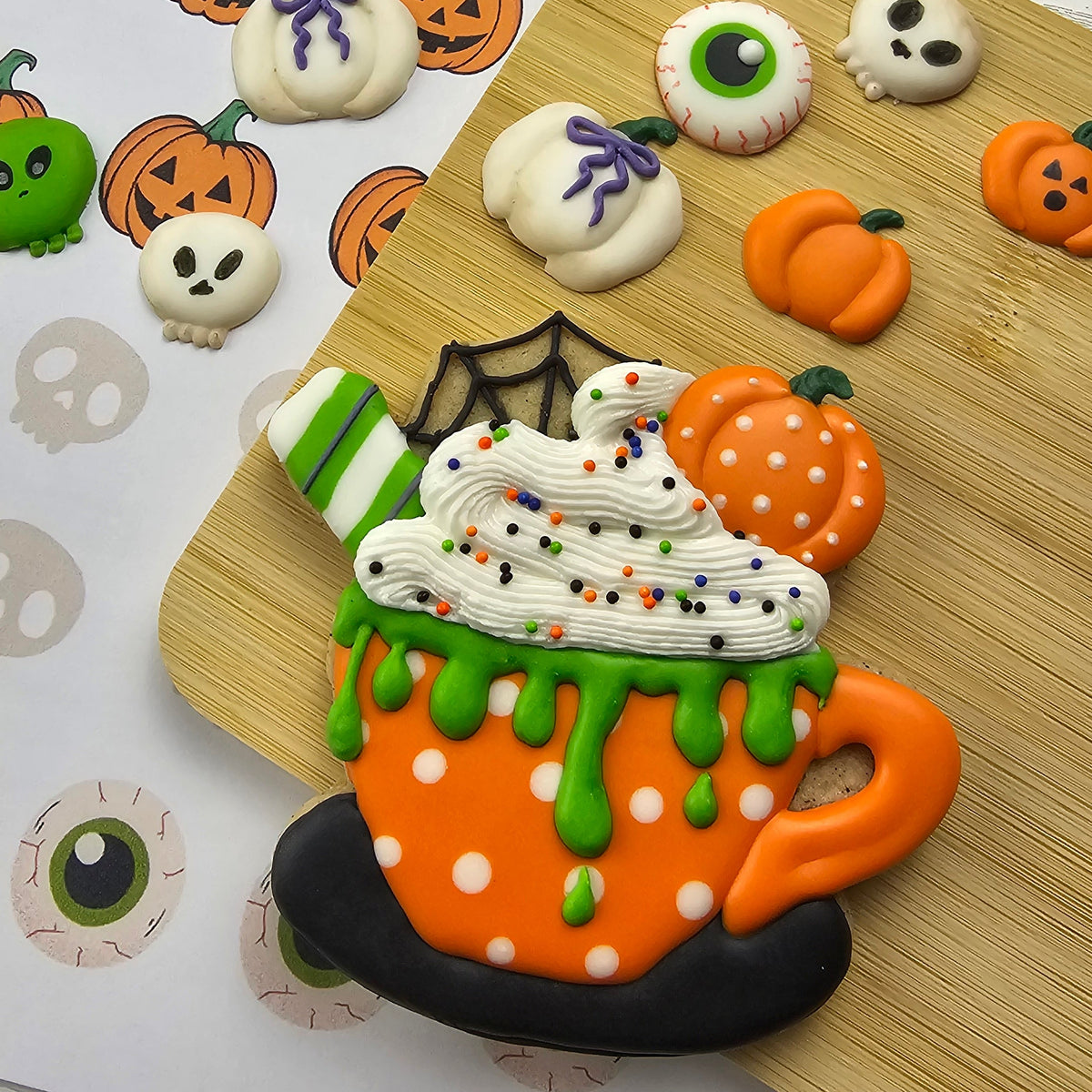 Halloween decorated sugar cookie mug with royal icing transfer accents