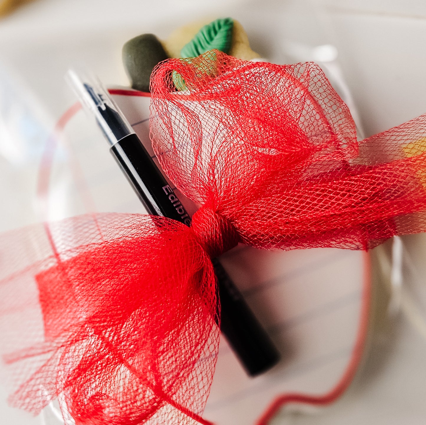Apple Sugar Cookie tied with a bow
