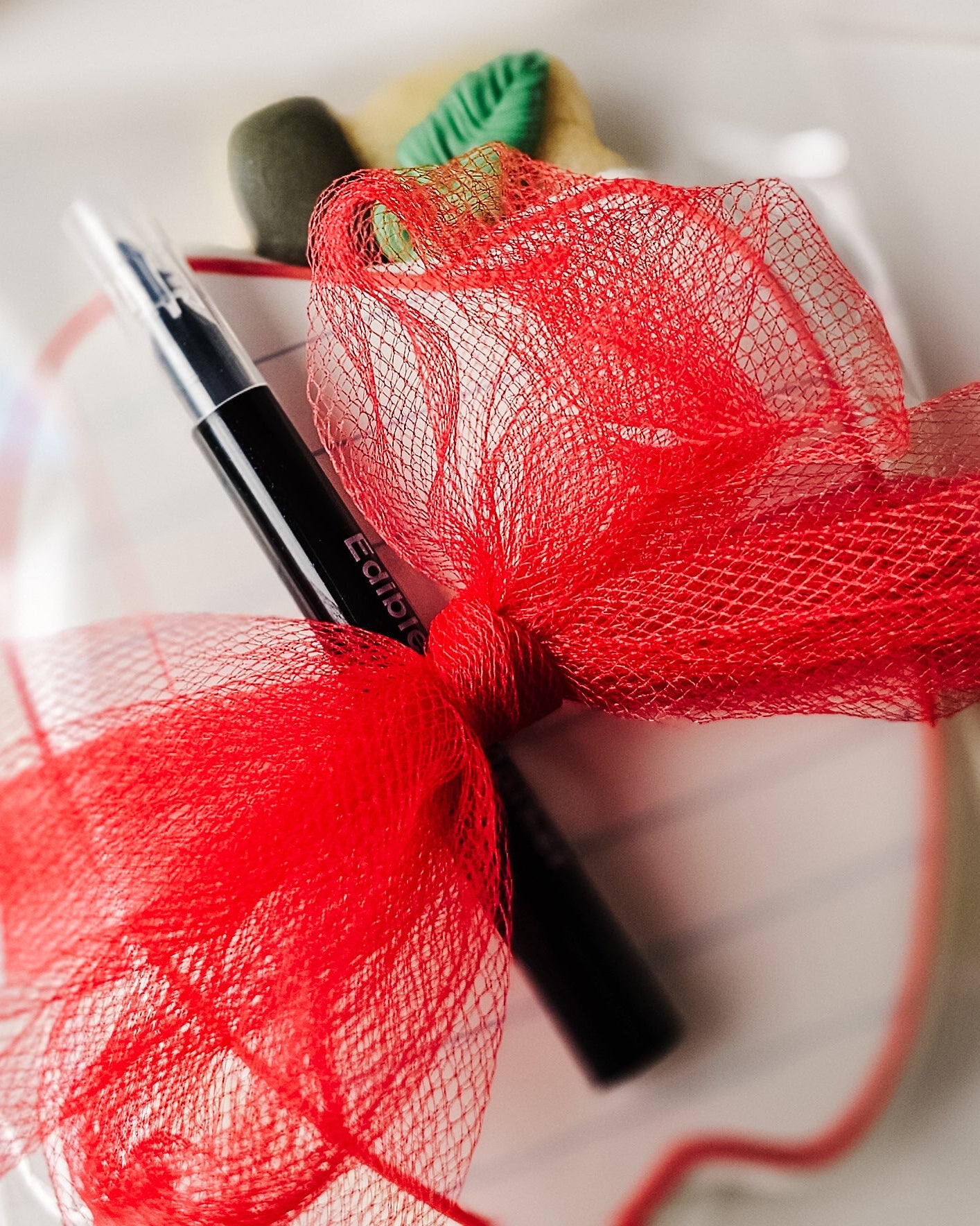 Apple Sugar Cookie tied with a bow