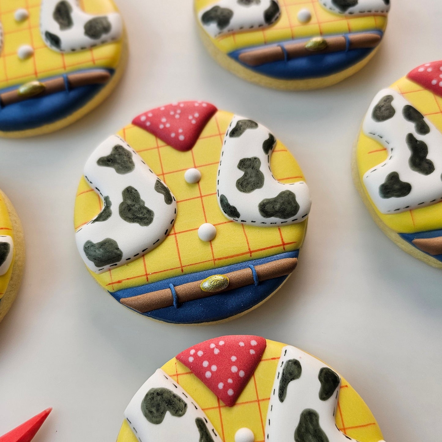 Decorative Toy Story themed sugar cookies on a white background