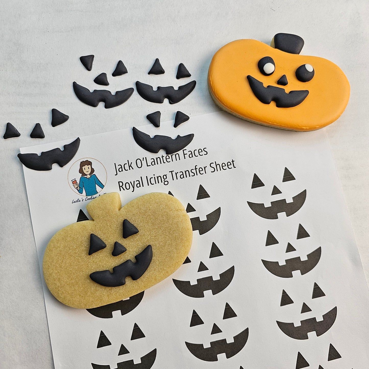 Jack O Lantern face royal icing transfers and pumpkin sugar cookies