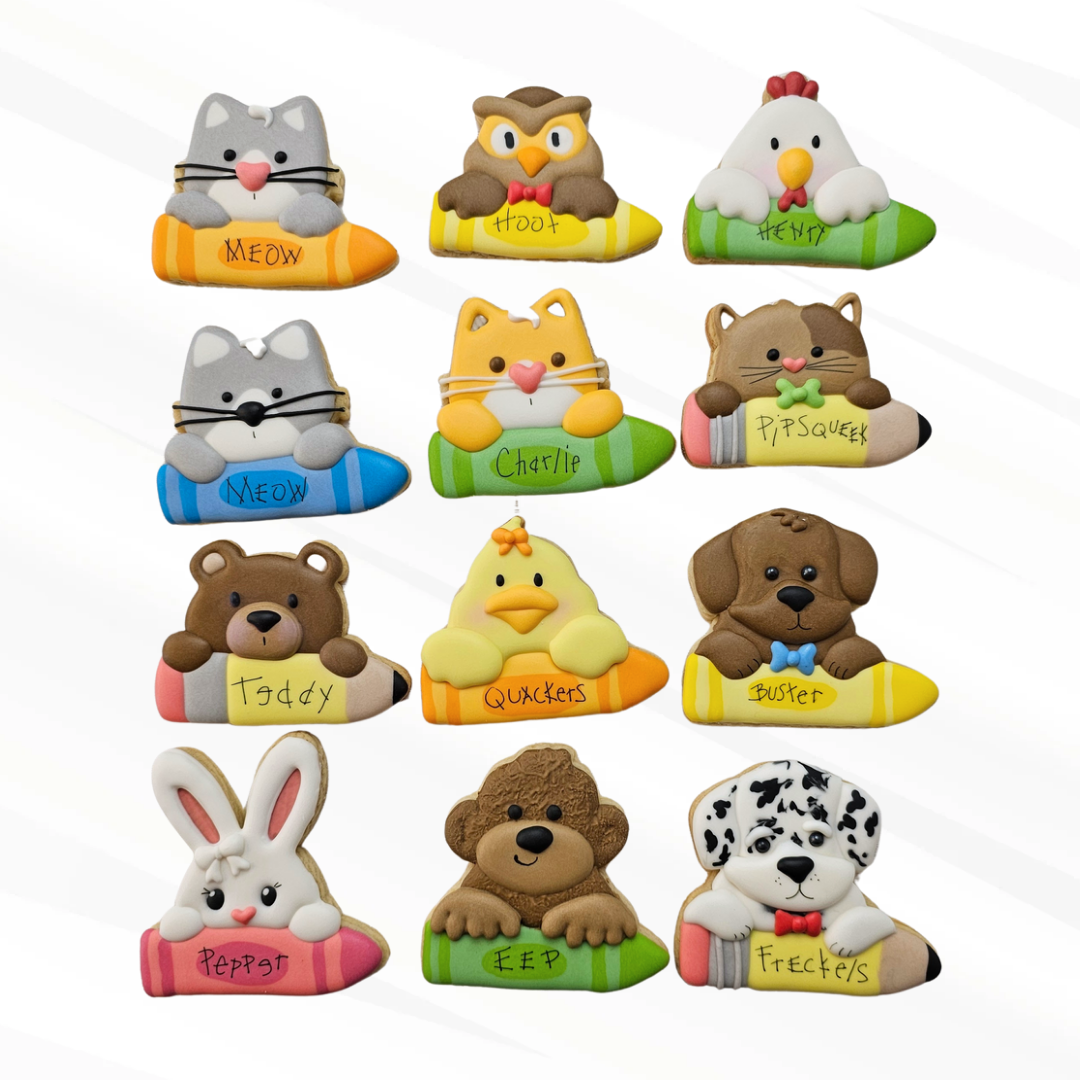 9 sugar cookie animals holding pencils and crayons