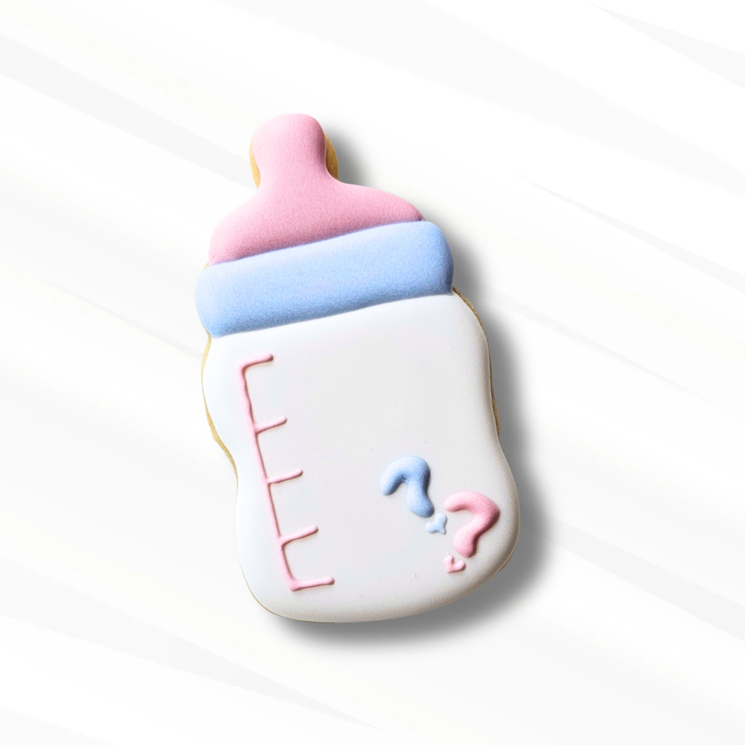 White baby bottle sugar cookie with pink and blue accents