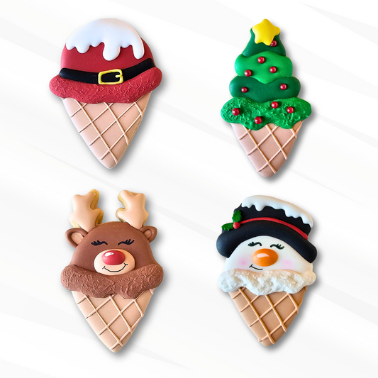 Four ice cream cone-shaped Christmas-themed cookies on a white background
