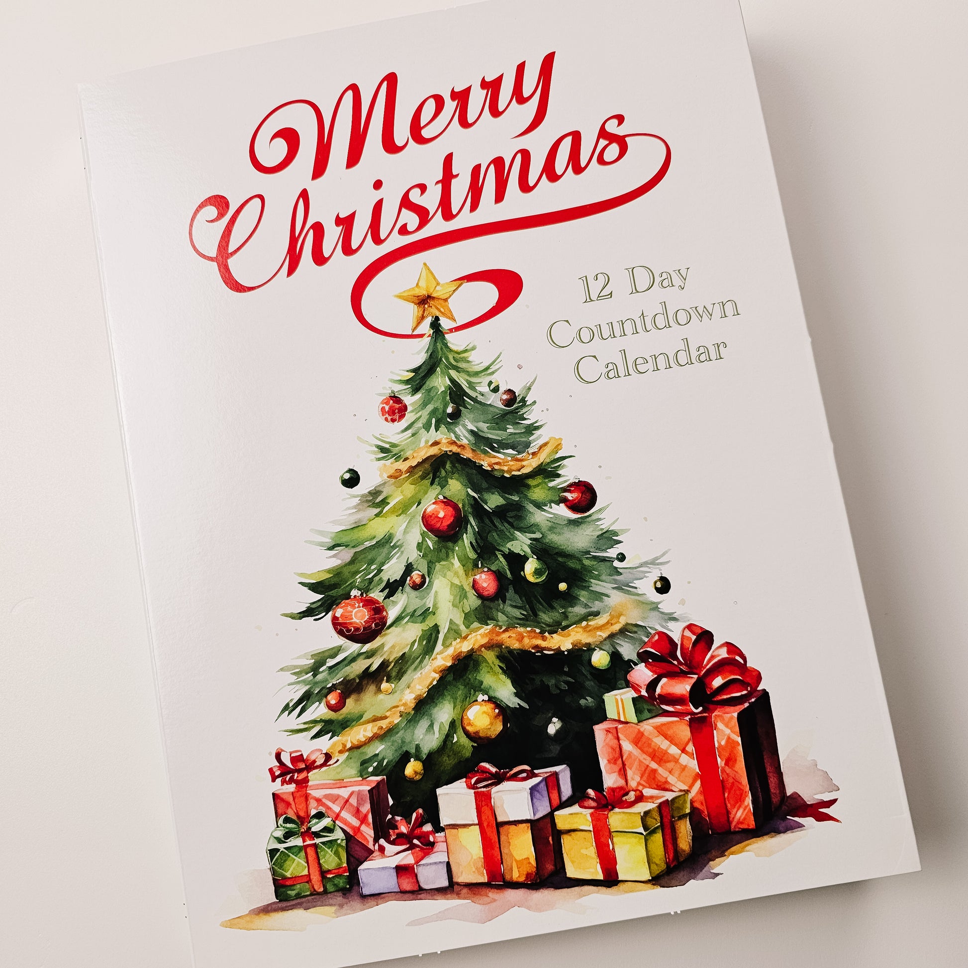 Christmas cookie advent calendar with a tree and presents on a white background