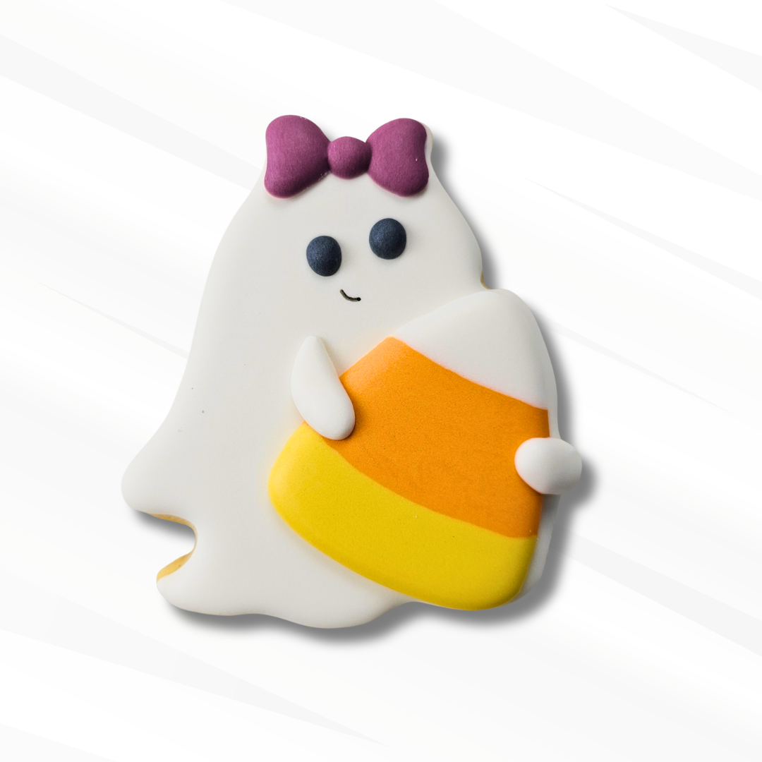 A cute Halloween ghost sugar cookie holding a candy corn, decorated with a purple bow, on a white background with subtle diagonal shadows.