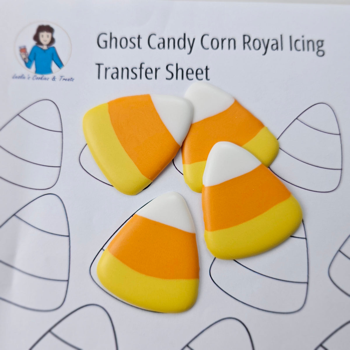 Large candy corn royal icing transfers piped on the printed template