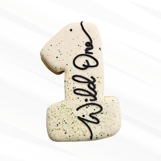 Number one shaped cookie with 'Wild One' text on a white background
