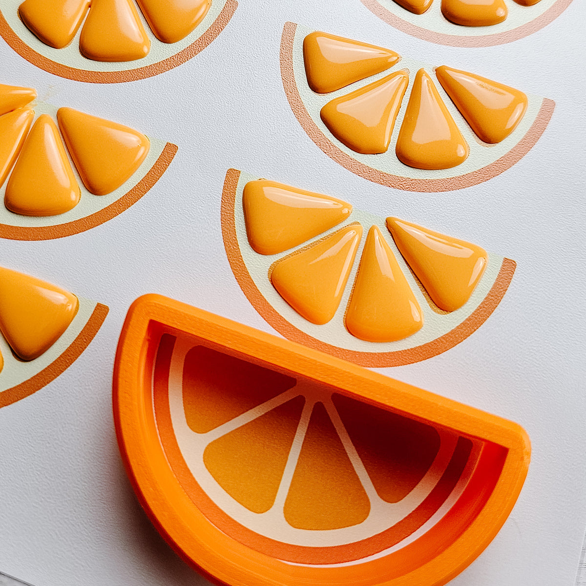 Orange wedge royal icing transfers with a half circle cookie cutter