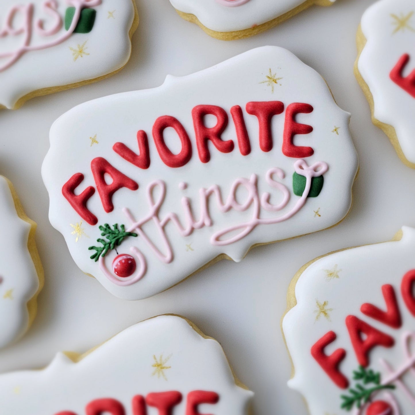 Decorative sugar cookies with 'FAVORITE things' text on a white surface