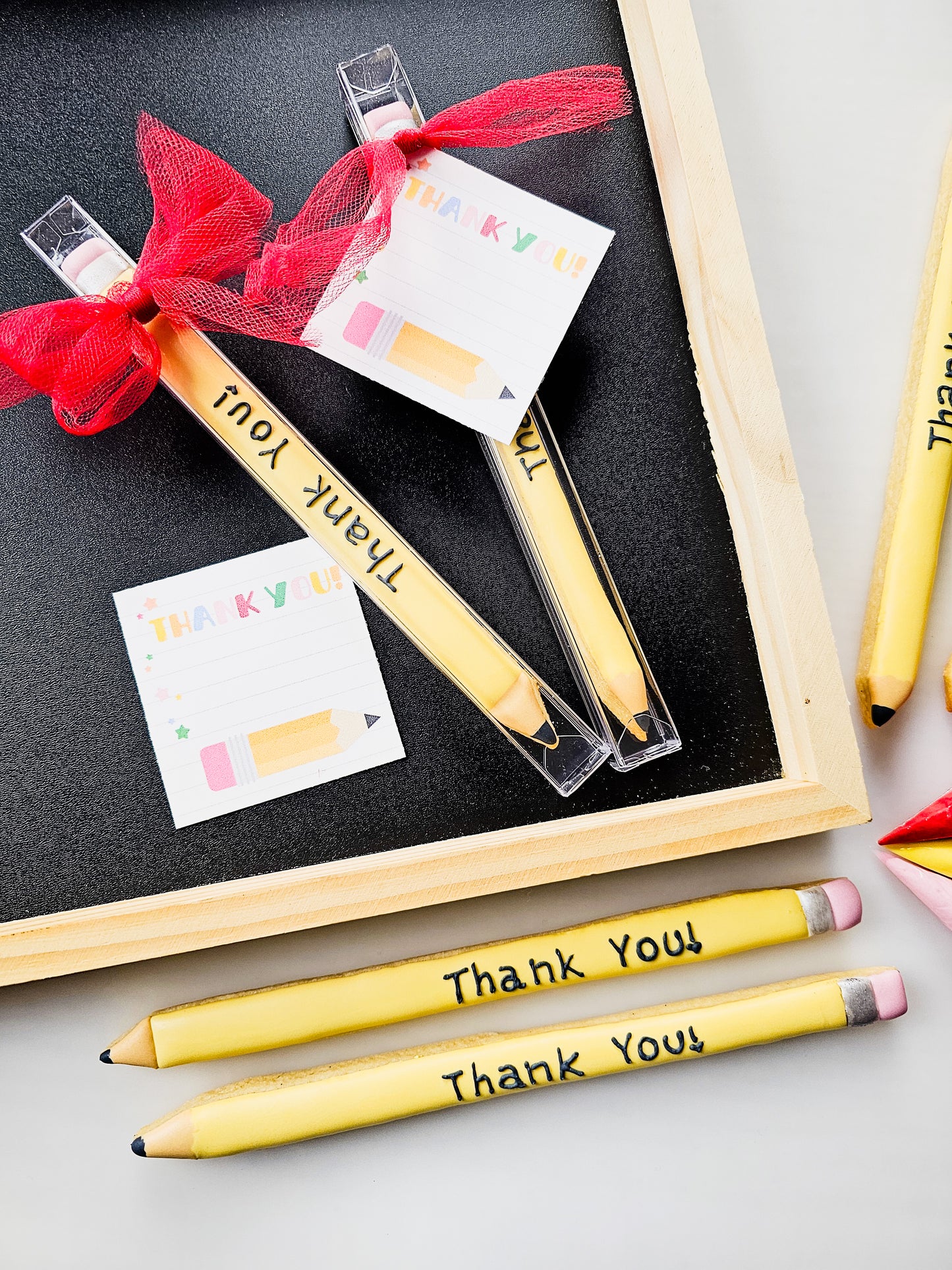 Skinny pencil decorated sugar cookies for Teacher appreciation week that say thank you