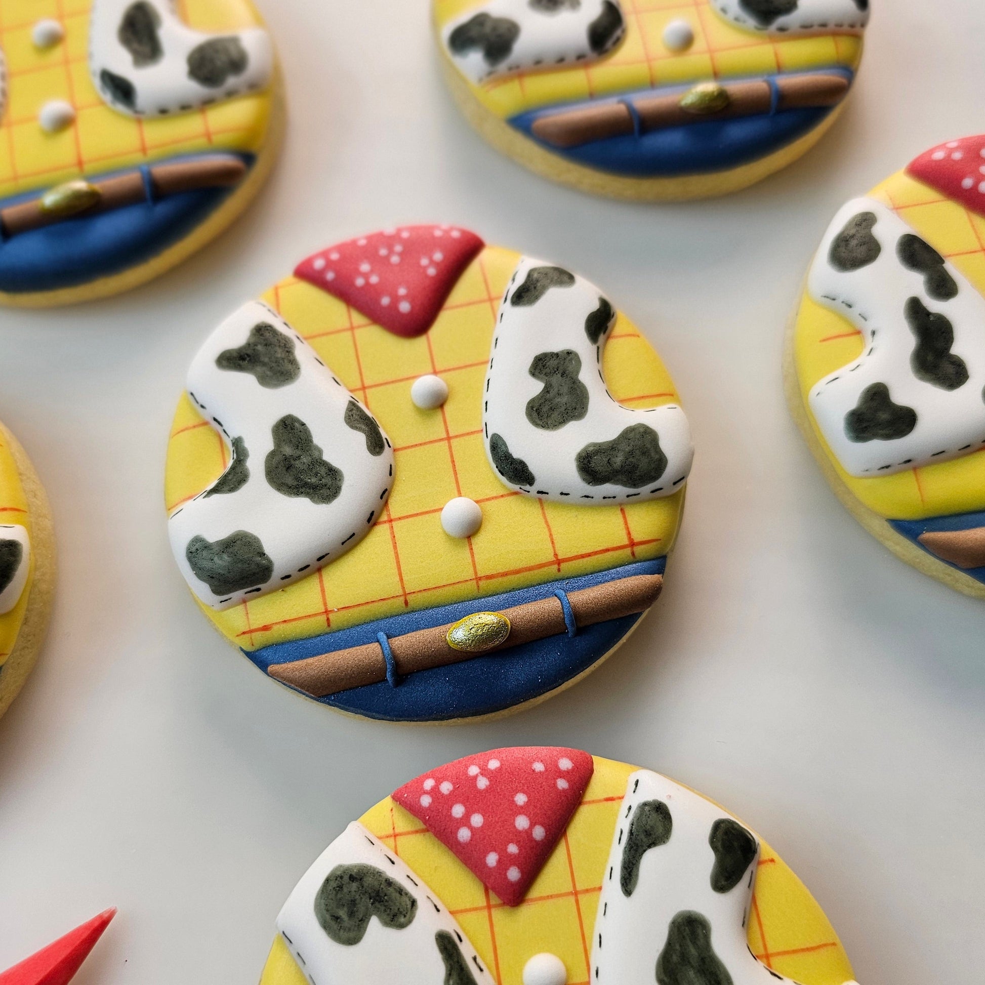 Decorative Toy Story themed sugar cookies on a white background