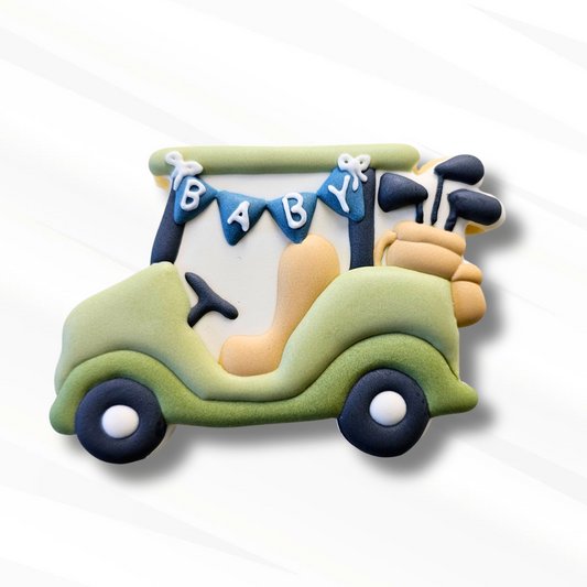 Decorated golf cart sugar cookie on a white background